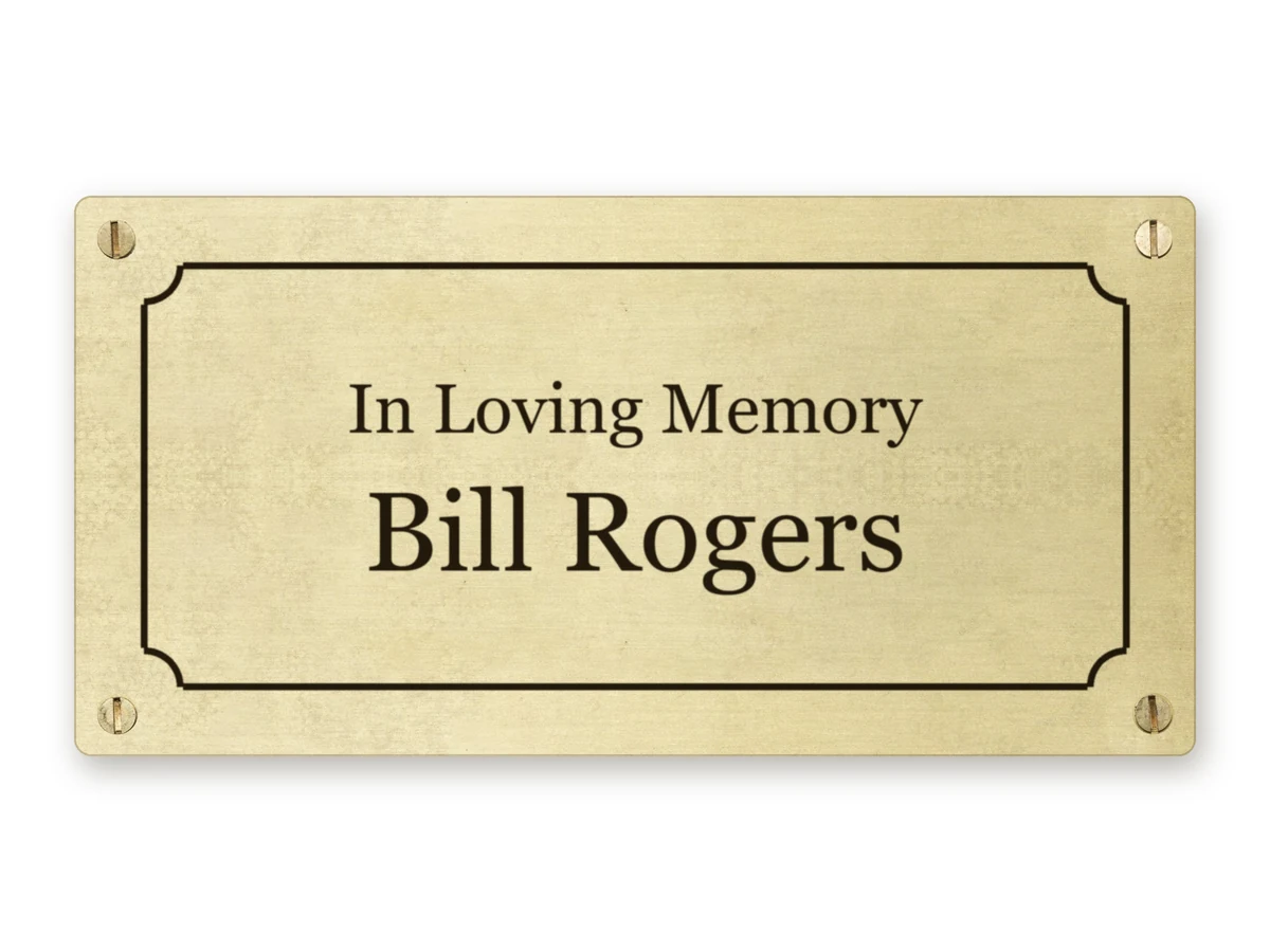 Brass memorial plaque with a traditional border