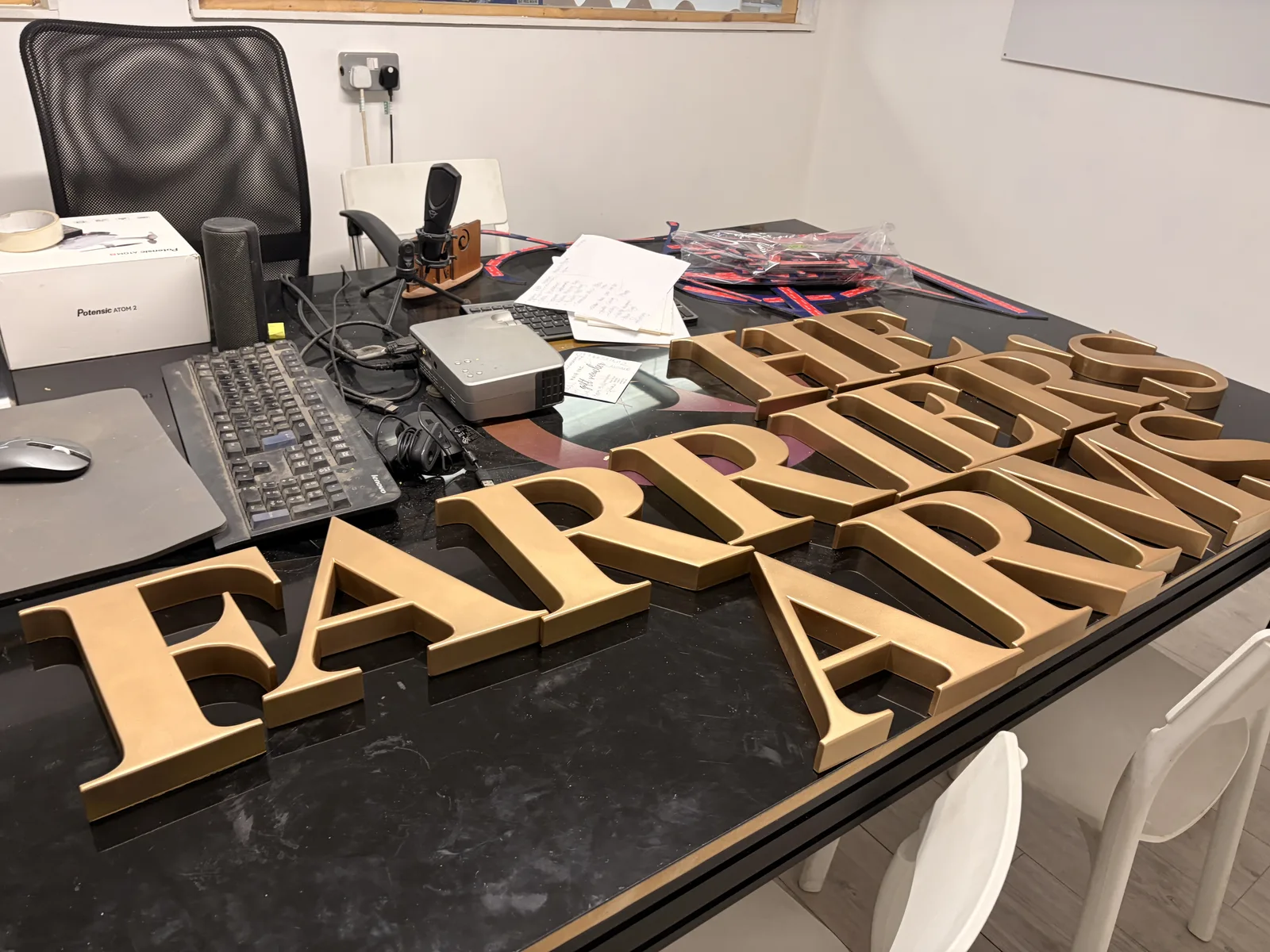 Gold built-up letters for the Farrier's Arms on the bench before fitting