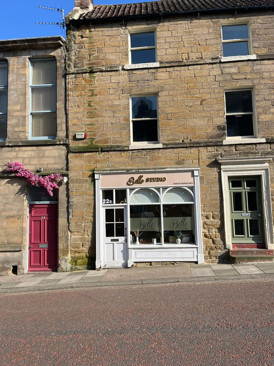 Brass letters on a painted fascia for Hannah Bell Hair